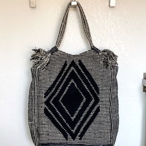 Large boho bag with diamond crotchet pattern.